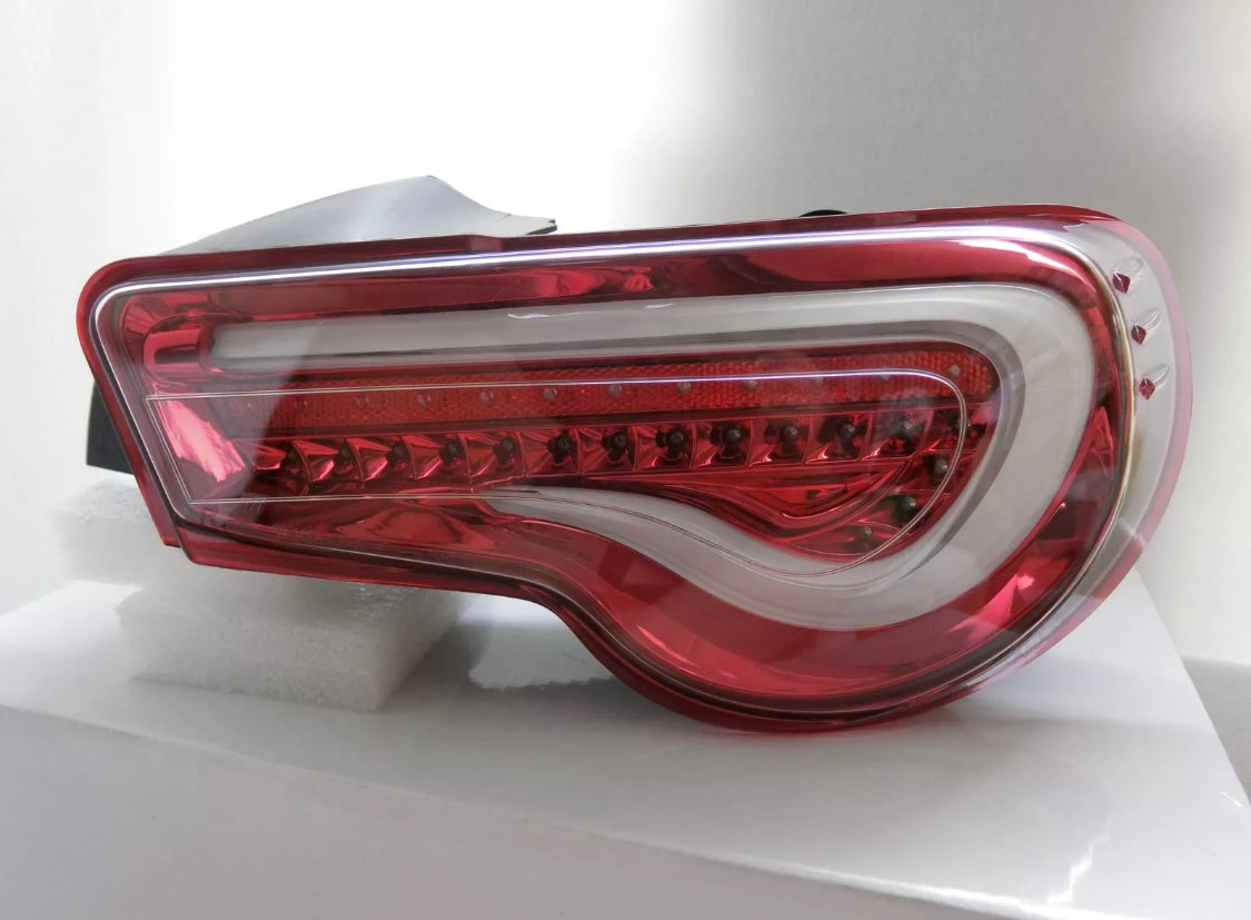Clear lense/ red housings Valenti tail lights